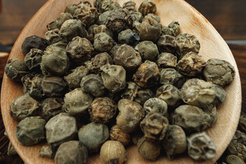 Macro photo of.green peppercorns on table