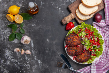 Naklejka na ściany i meble top view meat cutlets with salad and bread on grey background food meal dish photo