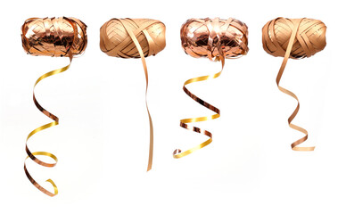 Festive gold ribbon roll isolated on a white background