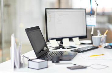 business, work and interior concept - laptop computer, gadgets and stationary on table at office
