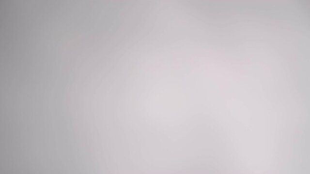 Blurry dark shadows moving on the wall. Spooky shadow art noise texture. closeup the motion of shadow batten of lath light on white wall texture background. Slow motion video. stock footage
