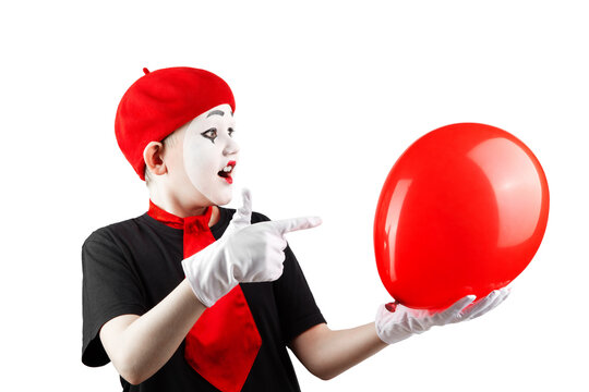 teenage boy in the image of a mime with makeup on his face, with a balloon, isolate on a white background