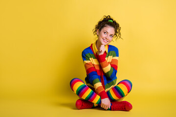 Full body photo of girl sit floor think thoughts look copyspace isolated over bright shine color background