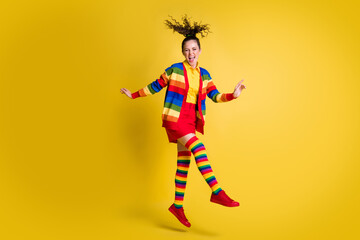 Full length photo of cheerful teen girl jump wear rainbow outfit isolated over bright shine color background