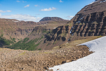 Rocks and snow on the Putorana Plateau. Taimyr. Russia