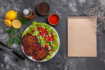 top view meat cutlets with tasty salad and bread on a grey background meal dish photo food