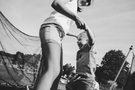 happy family on a trampoline - Powered by Adobe