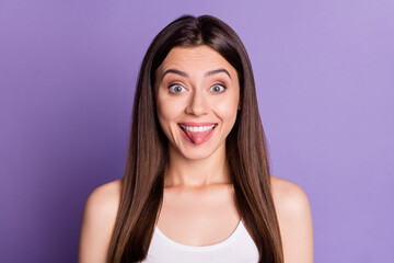 Photo of charming tricky young lady dressed casual white clothes showing tongue isolated purple color background