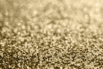 Abstract gold glitter sparkle blurred with bokeh background