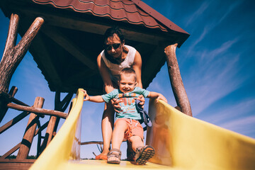 baby with mom on the playground