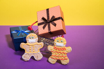 A family of gingerbread men on a shopping trip during the coronovirus pandemic. The concept of caring for the safety of loved ones