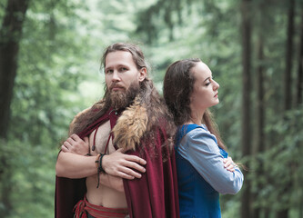 Brave Warrior Viking man with beautiful medieval woman standing