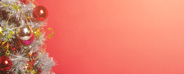 Christmas tree with toys, balls, garlands and lights, new year background. Copy space. Place for text