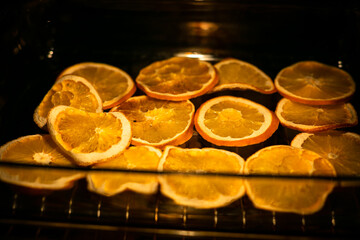 Dried orange in the oven. Decoration for the New Year's table. Decor for Christmas dishes. Orange slices.
