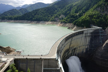 Draining water from Kurobe Dam in Tateyama Kurobe Alpine Route, Toyama, Japan - 黒部ダム 放水 富山県 中新川郡 立山町 日本	