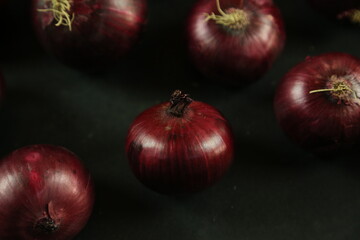 sweet red onions on background