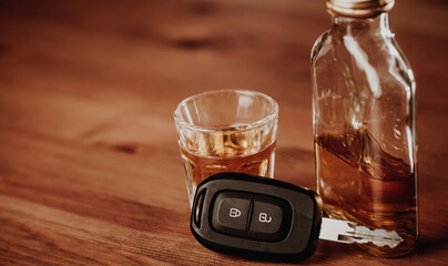 Do not drink and drive concept, Close up of car keys and glass of strong an alcohol
