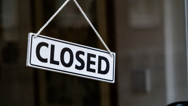 A closed sign on a shop window