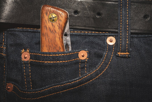 A Folding Knife With A Wooden Handle In The Pocket Of His Jeans. EDC Knife.