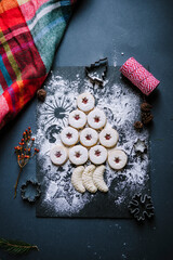 Obraz na płótnie Canvas dark food christmas butter shortbread gingerbread cookie bisquits with sugar, coconut and cinnamon. Winter holiday baked dessert