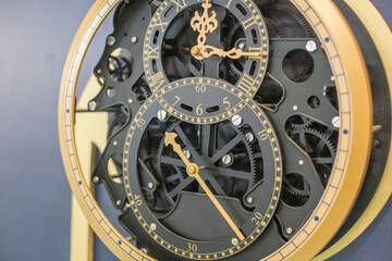 This clocks is opening showing the inside elements of the clocks workings.