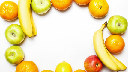 different fresh sweet fruits on frame on a white background with copy space for text. Healthy eating