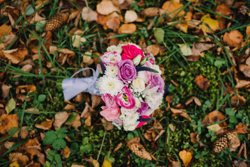 wedding flower bouquet lies on the foliage