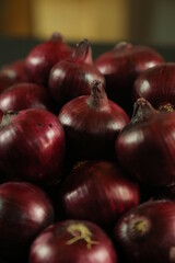 sweet red onions on background