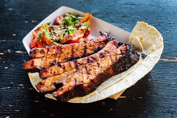 grilled ribs and salad, top view