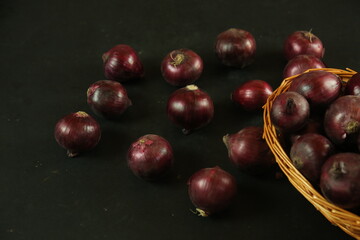 sweet red onions on background