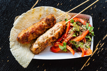 grilled kebab with salad, top view