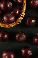 sweet red onions on background