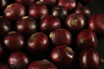 sweet red onions on background