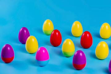 Colorful Plastic Easter Eggs on blue background