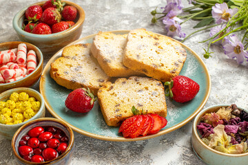 front view yummy cake slices with strawberries on light background fruits sweet cake pie