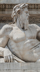 Sculptures of Roman at the Neptune Triumphal Arch called Arch of Peace (Porta Sempione) in Milan historical downtown, Sempione Park, Italy