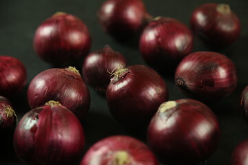 sweet red onions on background