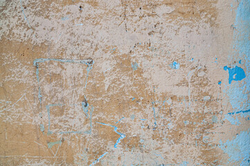 Biege concrete background with cracks and scratches