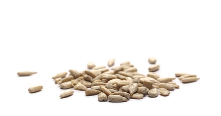 Peeled sunflower seeds pile isolated on white background