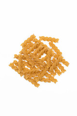 Many raw brown fusilli in jar in studio