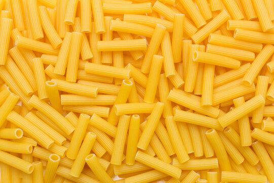 Many raw tortiglioni pasta in studio