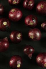 sweet red onions on background