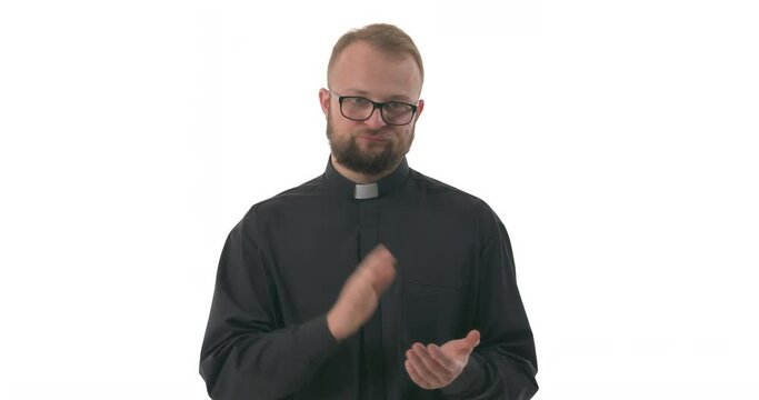 Annoyed Caucasian priest with pursed lips clapping hands. Human emotions concept. Isolated on white background