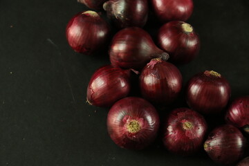 sweet red onions on background