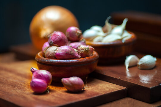 shallots and garlic in a wooden bowl