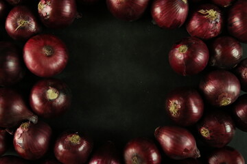 sweet red onions on background