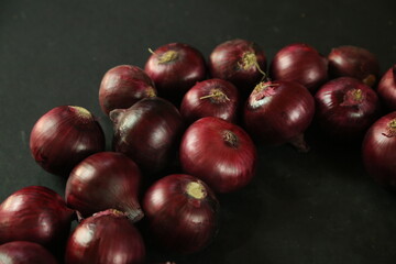 sweet red onions on background