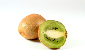 Close up of kiwi fruit and slice kiwi on white background.