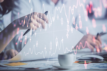 Double exposure of forex graph drawing over people taking notes background. Concept of financial...