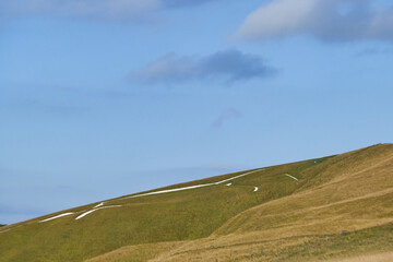 English countryside from White Horse Hill Uffington with horse drawing on hill